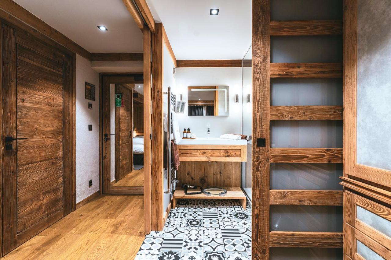 Comfort room with balcony and village view